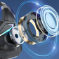 A close-up of a black and silver gaming headset with a floating exploded view of its internal components, including a clear lens, gold-toned rings, and blue glowing circular effects, set against a dark blue background.