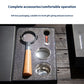A coffee preparation accessory set displayed in an open black gift box on a dark wooden surface. The set includes a metal and wood-handled tool, a small metal container, a round metal cup, and a small orange-handled tool, with text above describing complete accessories and gift box packaging.