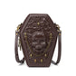 466117713-5 - Brown coffin-shaped shoulder bag with an embossed skull, cross detail, gold-tone skull studs and a draped front chain.
