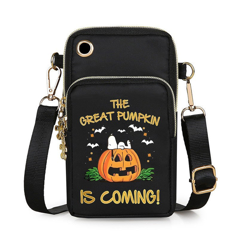 217095743-1 Black Halloween pumpkin mini crossbody bag with bat graphics, gold-tone zippers and an adjustable shoulder strap.
