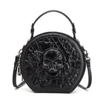 167243085-1 - Round black Halloween crossbody bag with an embossed skull, textured front, top handle and clip-on shoulder strap.
