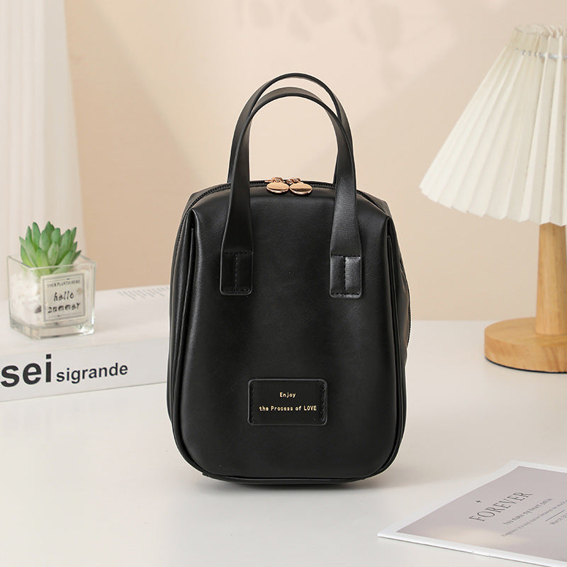 195381498-4 - a smooth black texture handbag for the women who is in need a of new fancy feeling handbag. 